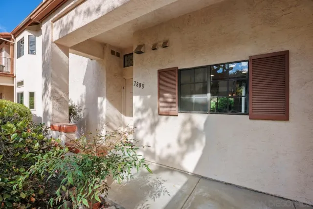 a view of a hallway with windows