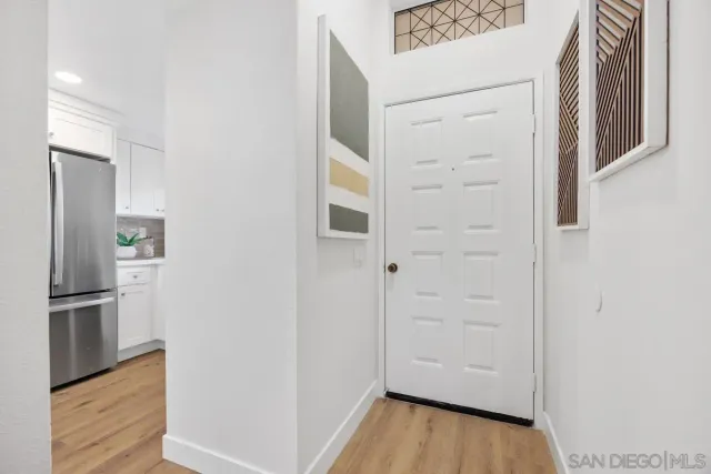 a living room with furniture potted plant and a fireplace