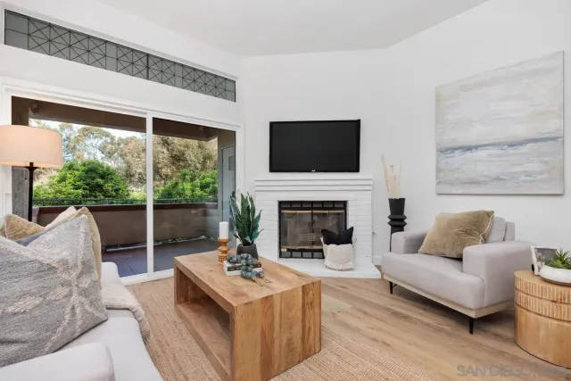 a living room with furniture or couch and a wooden floor