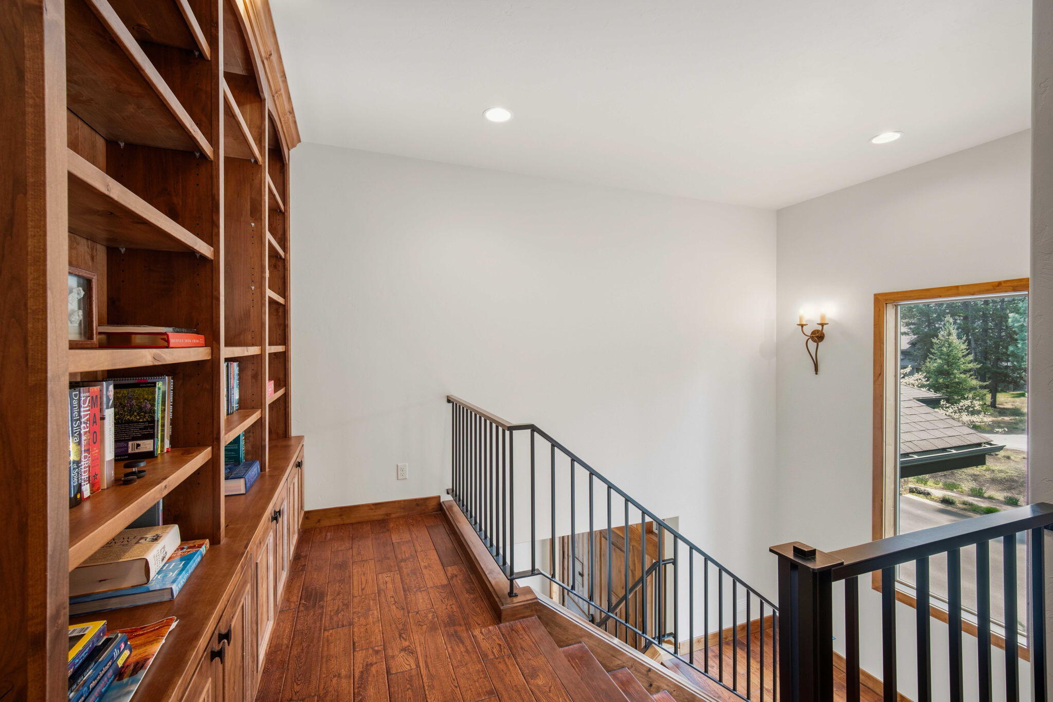 56328 Fireglass Loop Bend, OR 97707 - Photo 35 of 72 Custom bookshelves at the top of the stairs to the second level.