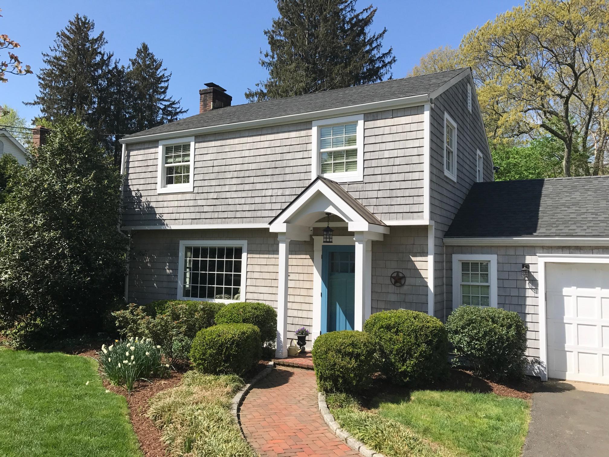 23 Birch Road Darien, CT 06820 - Photo 1 of 17 a view of a house with a yard and plants