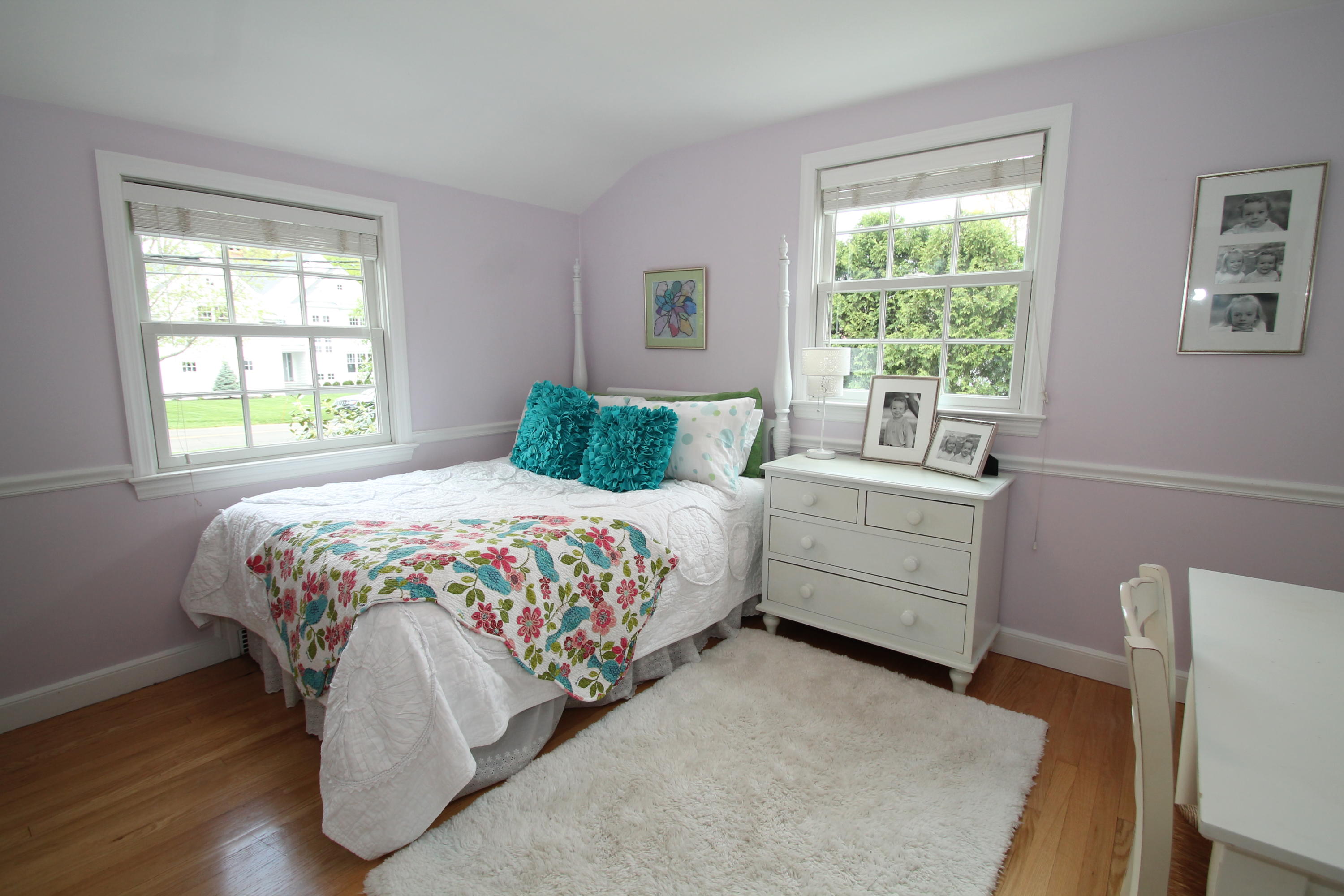 23 Birch Road Darien, CT 06820 - Photo 11 of 17 a bedroom with a bed wooden floor and window