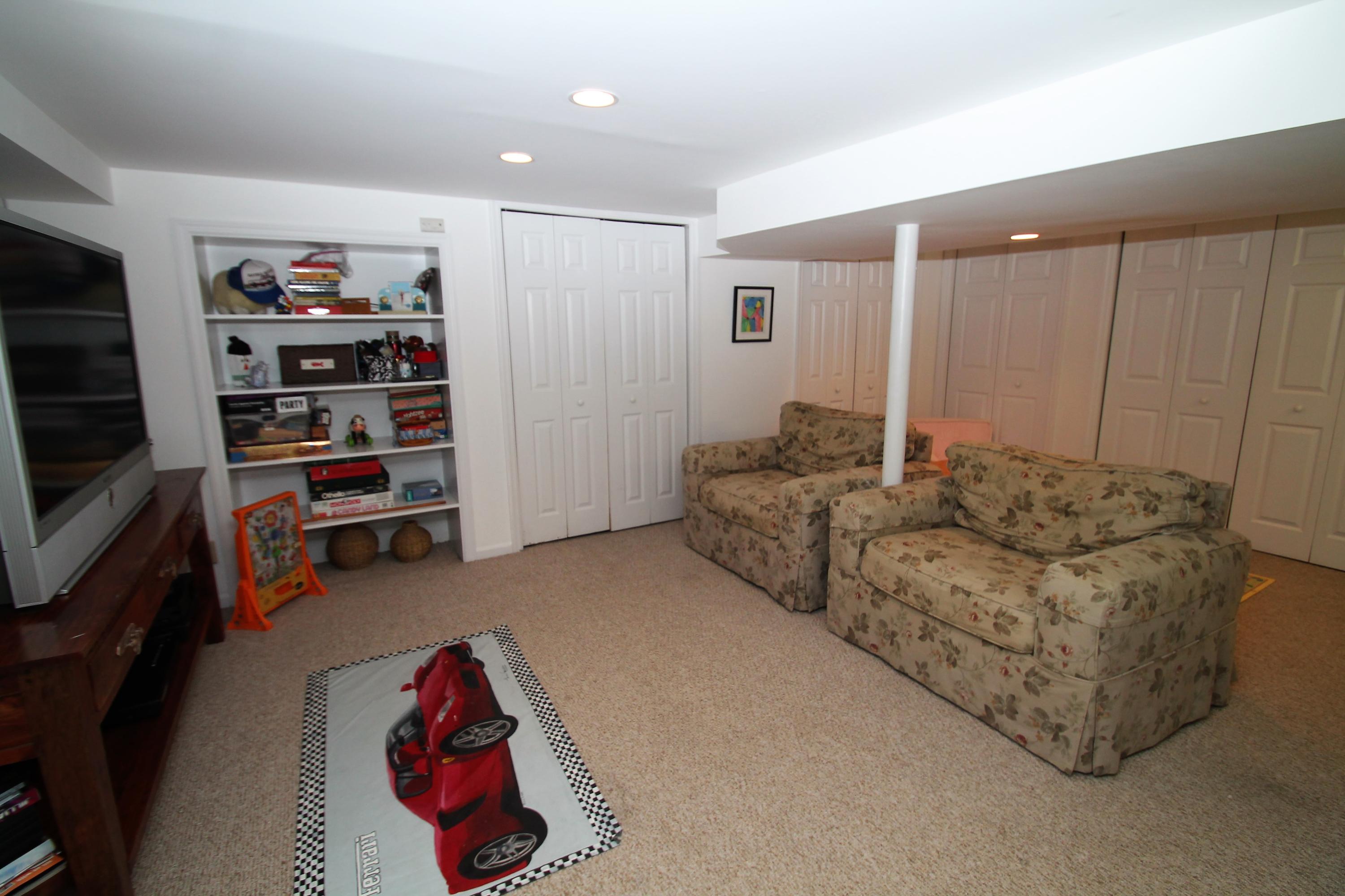 23 Birch Road Darien, CT 06820 - Photo 13 of 17 a living room with furniture and closet