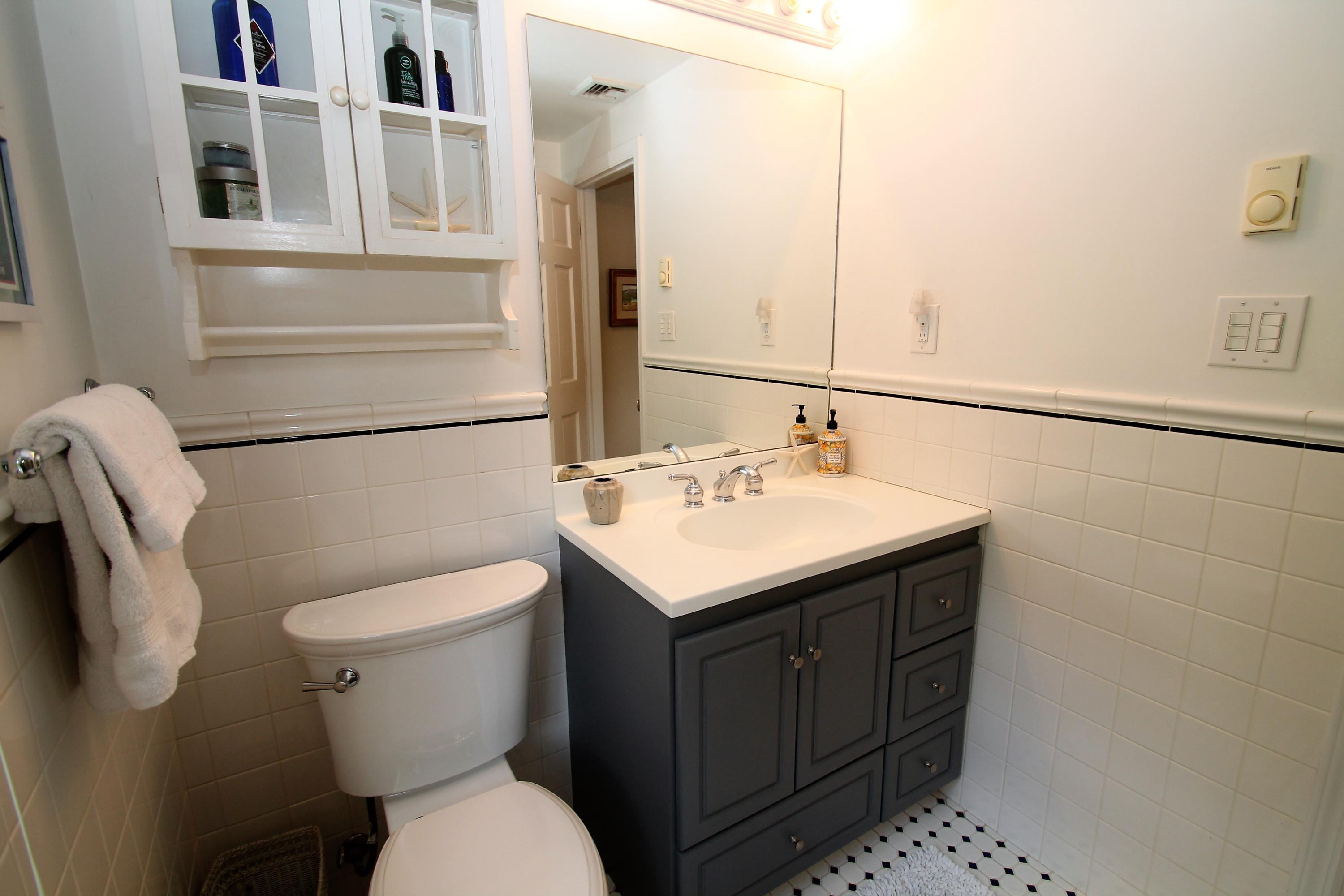 23 Birch Road Darien, CT 06820 - Photo 15 of 17 a bathroom with a sink a toilet and shower