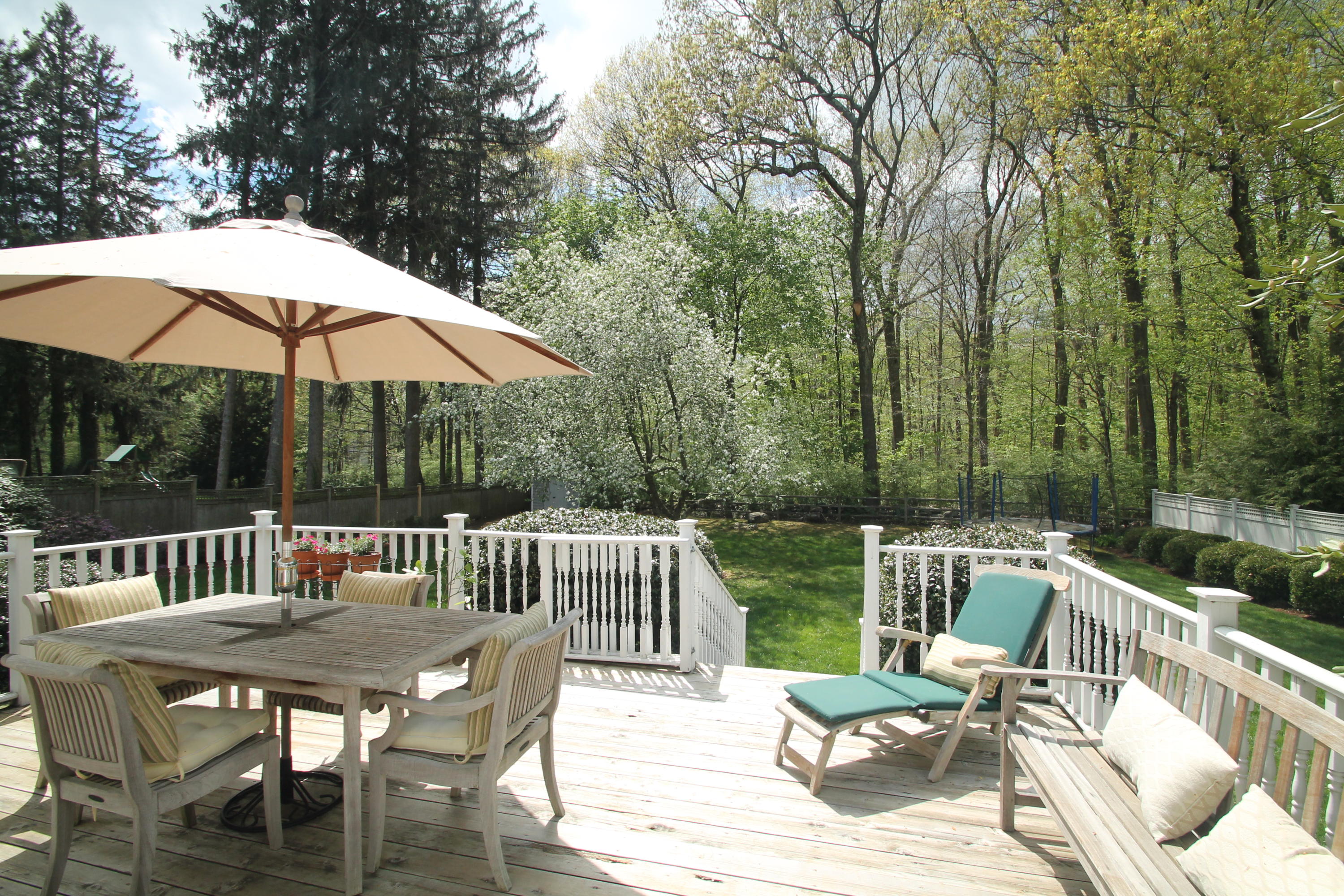 23 Birch Road Darien, CT 06820 - Photo 3 of 17 a view of a patio with a table chairs and a barbeque