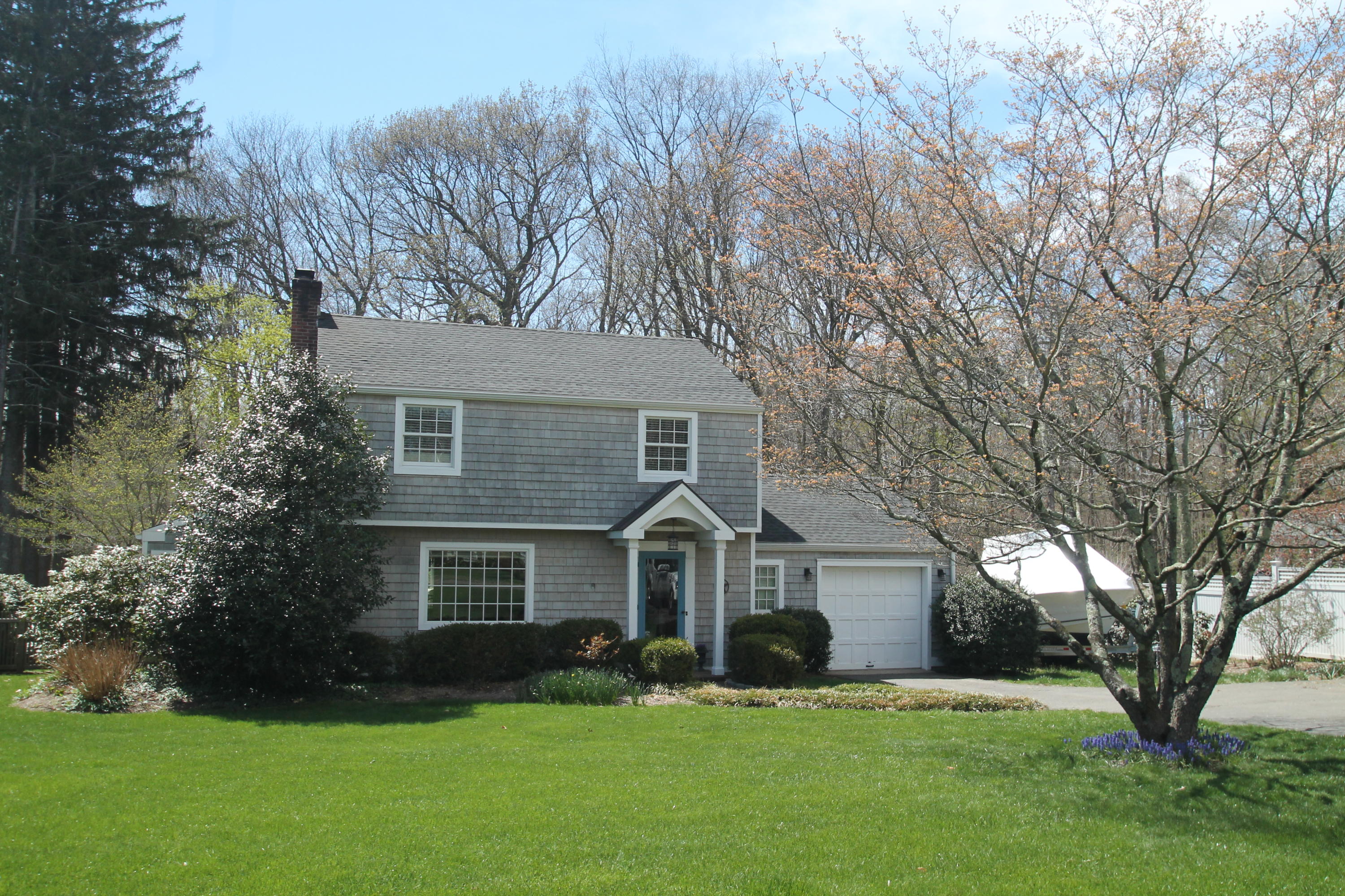 23 Birch Road Darien, CT 06820 - Photo 5 of 17 a front view of a house with a yard and garage