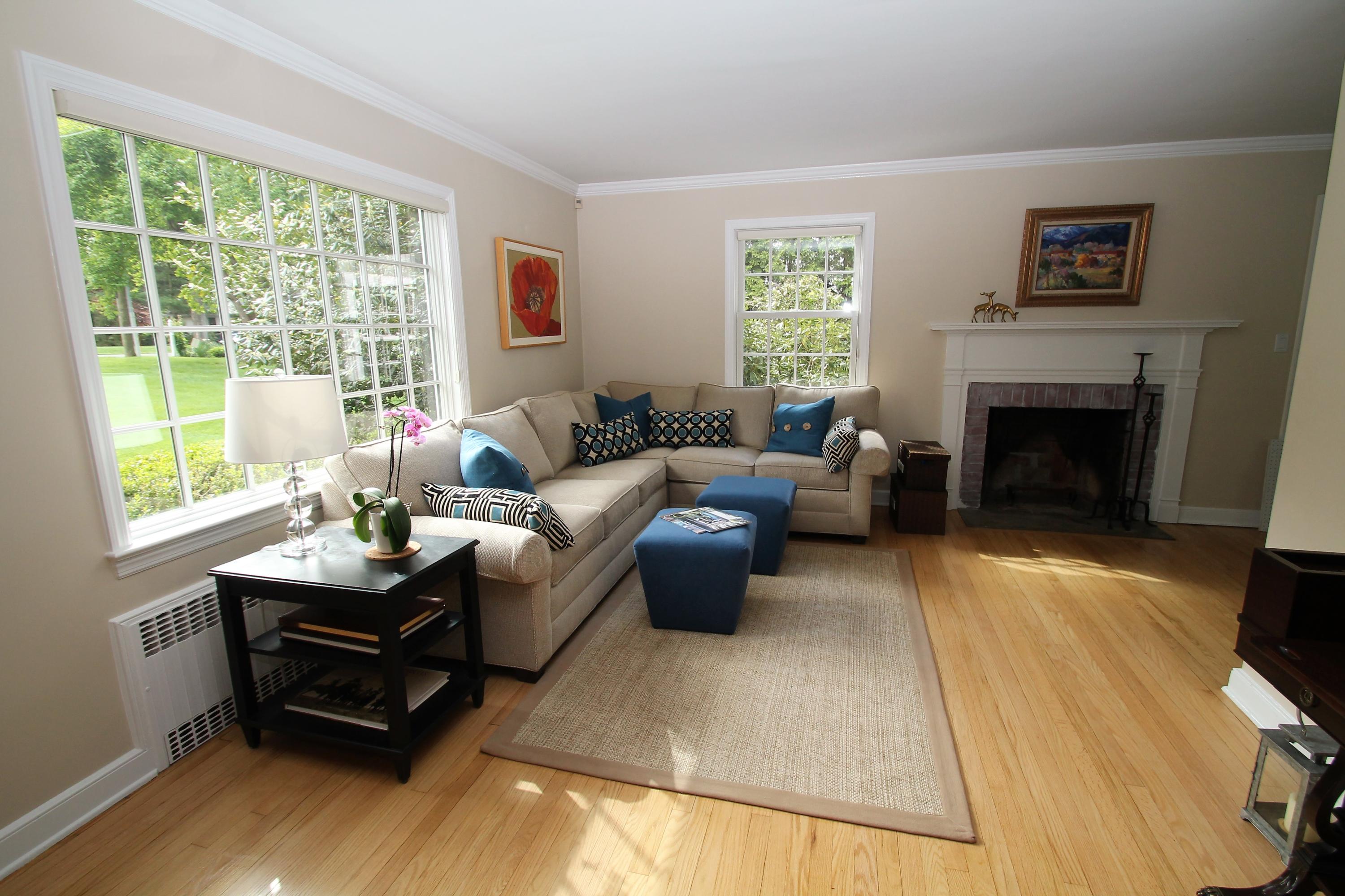 23 Birch Road Darien, CT 06820 - Photo 6 of 17 a living room with furniture and a fireplace