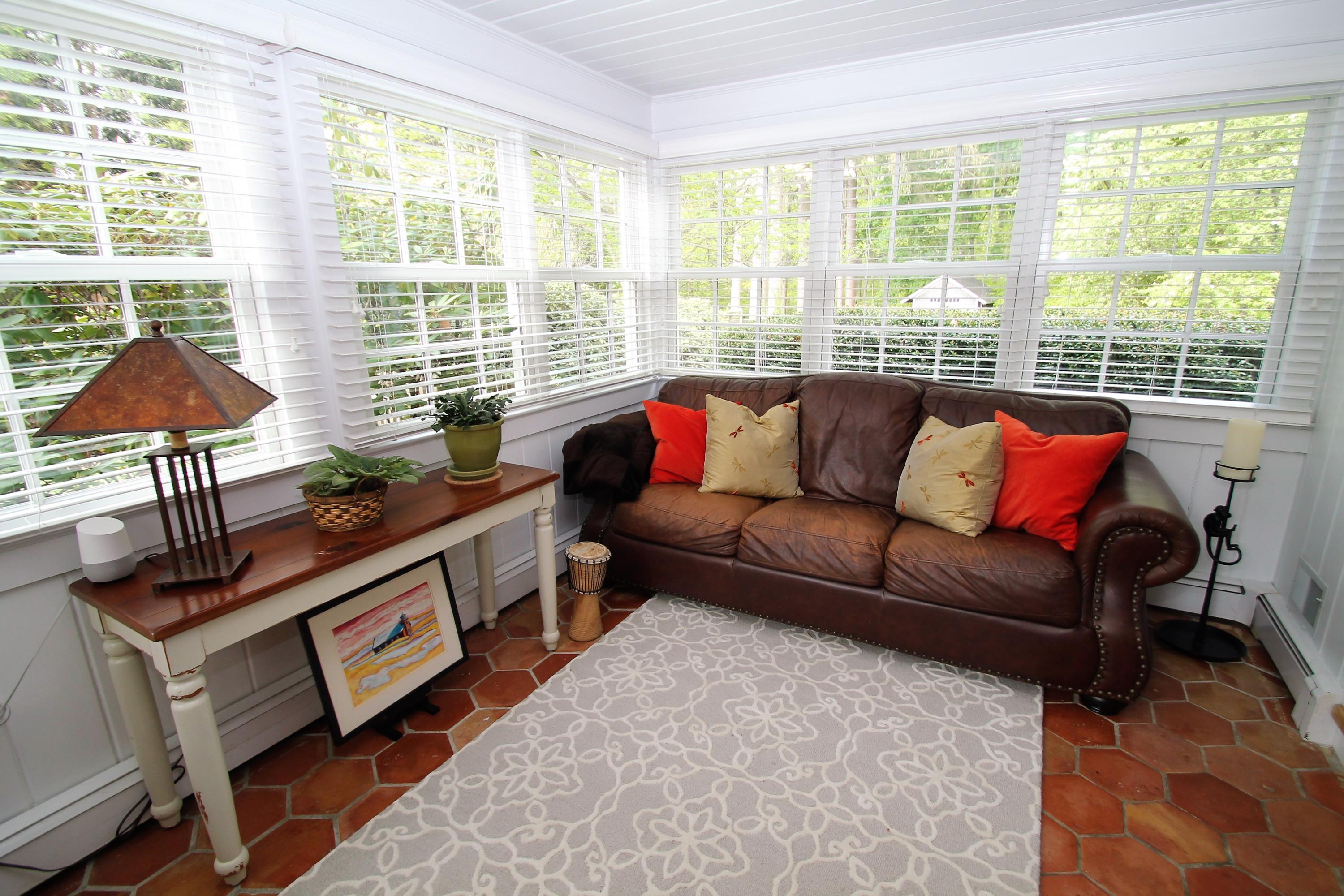 23 Birch Road Darien, CT 06820 - Photo 7 of 17 a living room with furniture and a large window