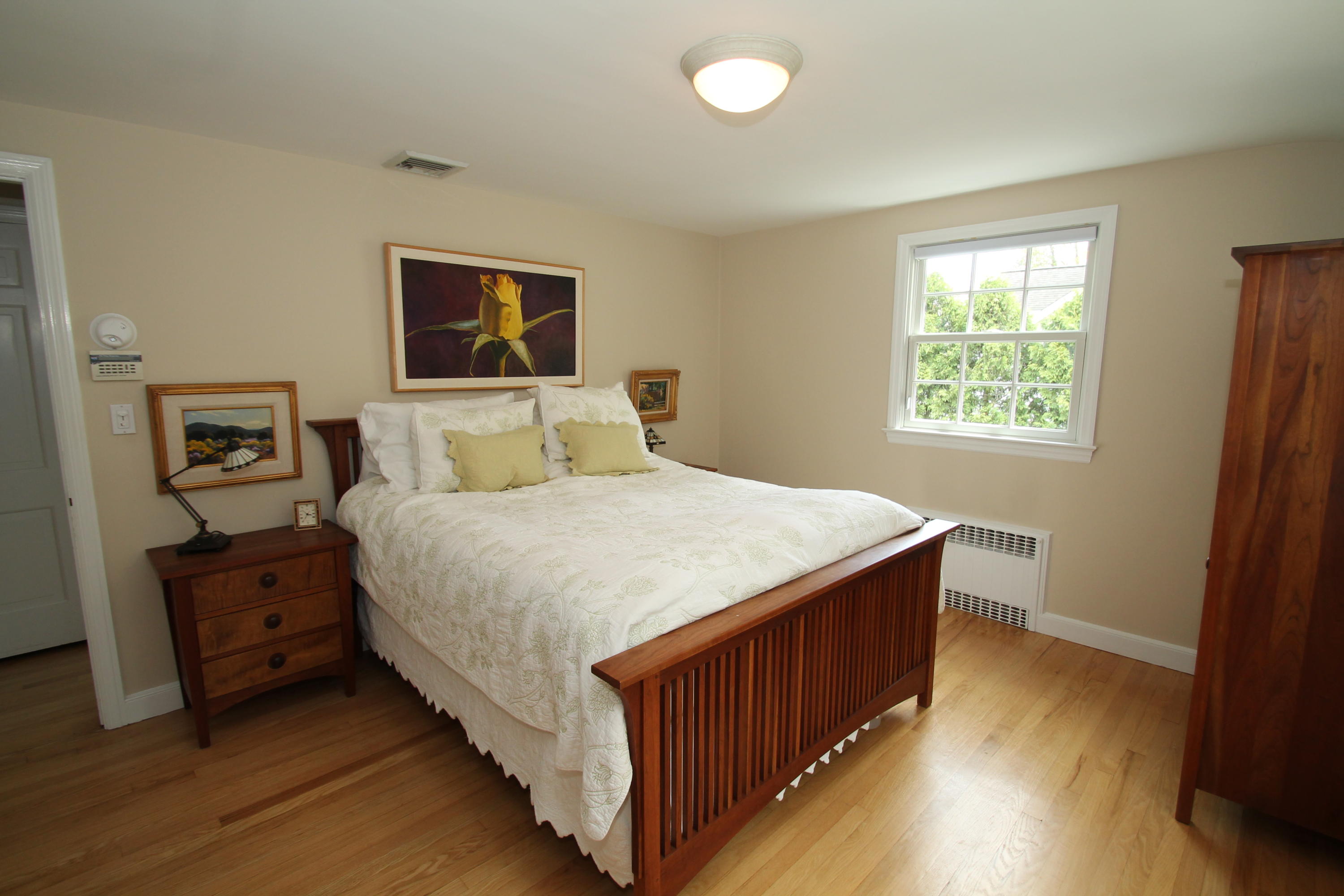 23 Birch Road Darien, CT 06820 - Photo 10 of 17 a bedroom with a bed and a window