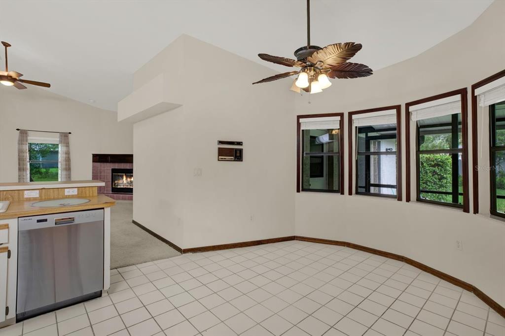 642 Erin Way Brooksville, FL 34601 - Photo 12 of 45 a view of a kitchen with a cabinet and a chandelier fan