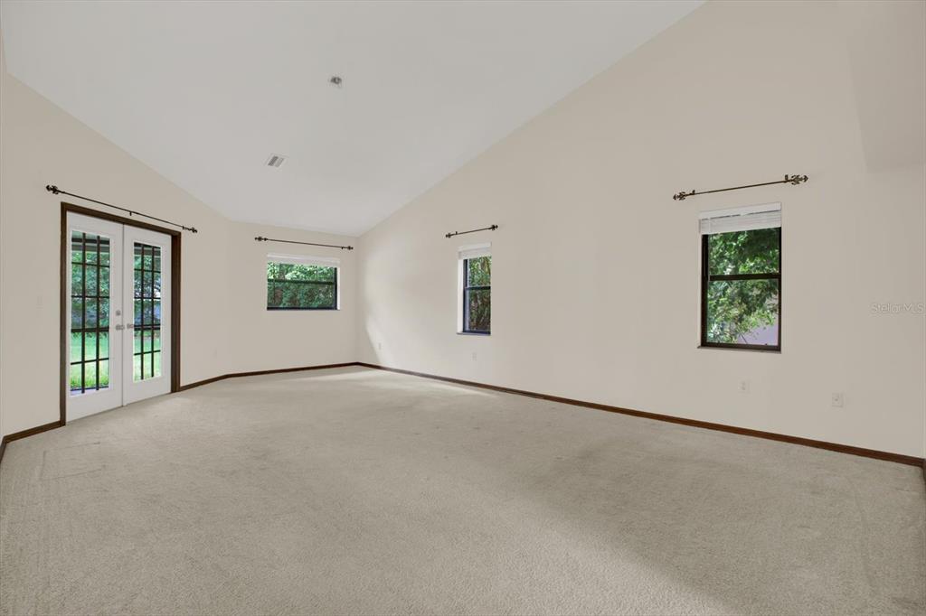 642 Erin Way Brooksville, FL 34601 - Photo 13 of 45 an empty room with windows