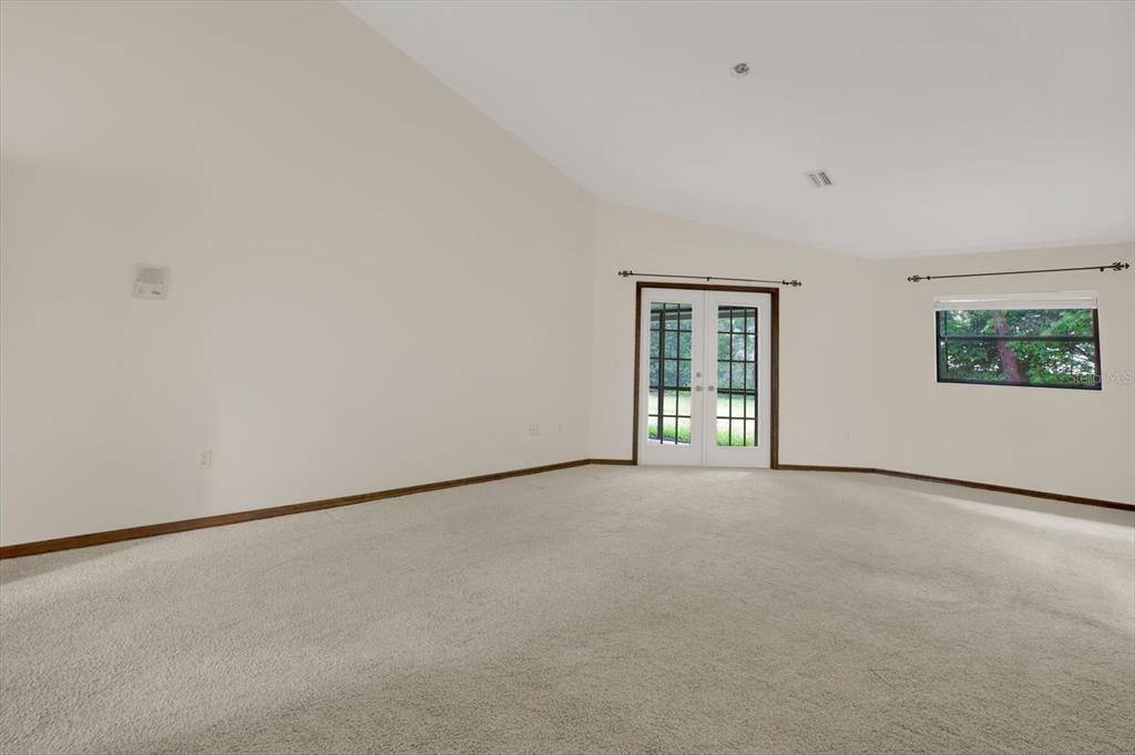 642 Erin Way Brooksville, FL 34601 - Photo 14 of 45 an empty room with windows