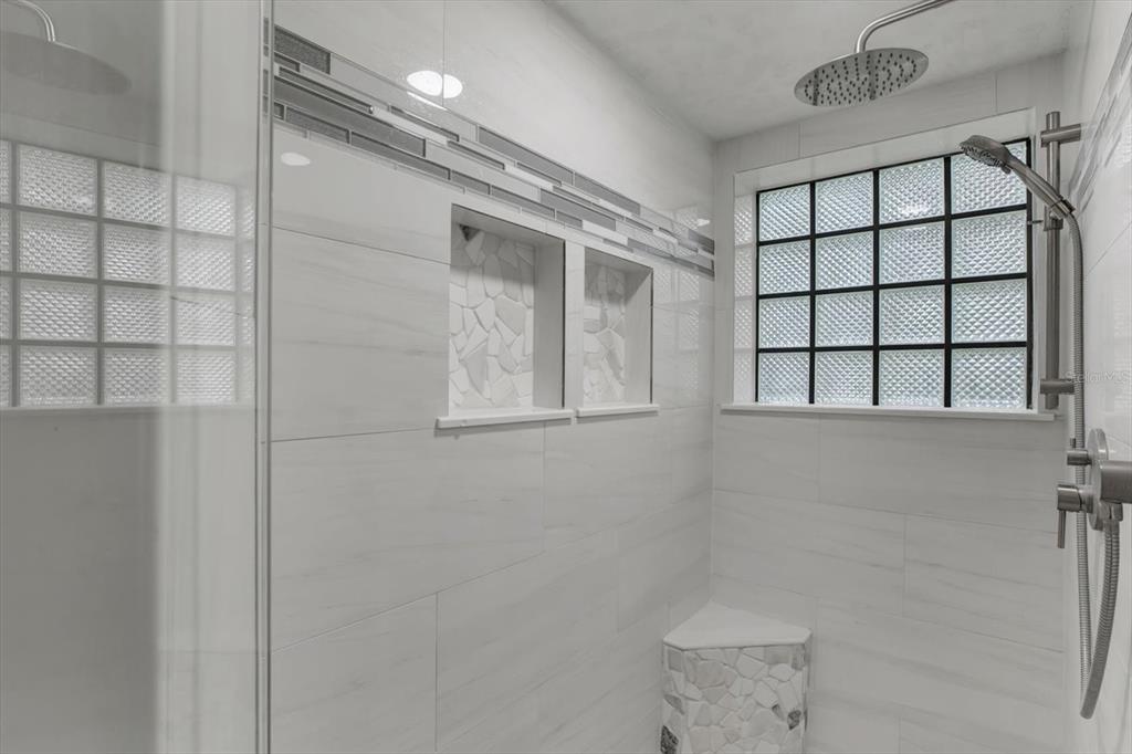 642 Erin Way Brooksville, FL 34601 - Photo 16 of 45 a bathroom with a shower