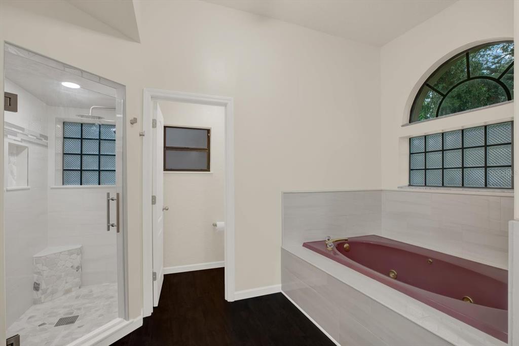 642 Erin Way Brooksville, FL 34601 - Photo 19 of 45 a bathroom with a tub and shower