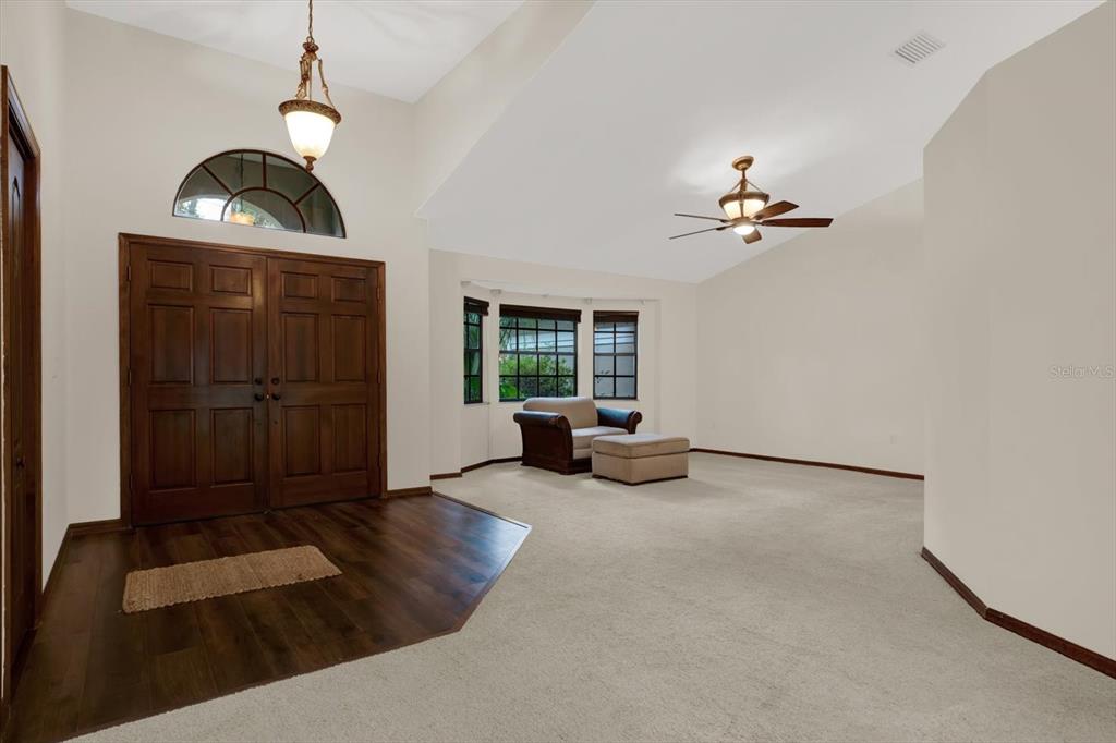 642 Erin Way Brooksville, FL 34601 - Photo 28 of 45 a view of a livingroom with furniture and hardwood floor
