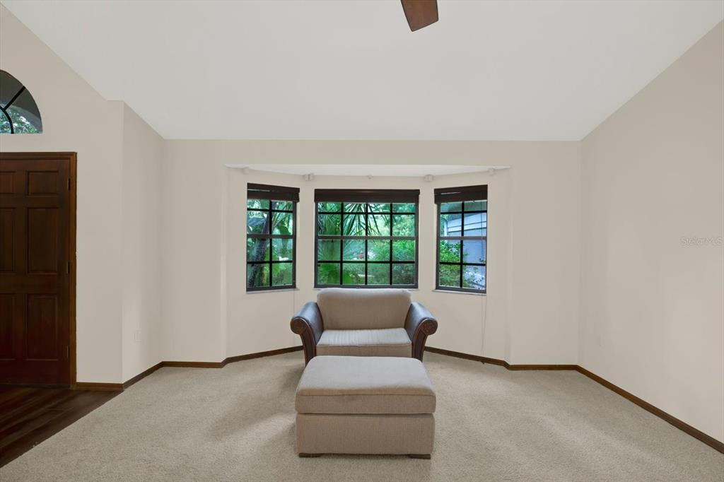 642 Erin Way Brooksville, FL 34601 - Photo 31 of 45 a living room with furniture and a window