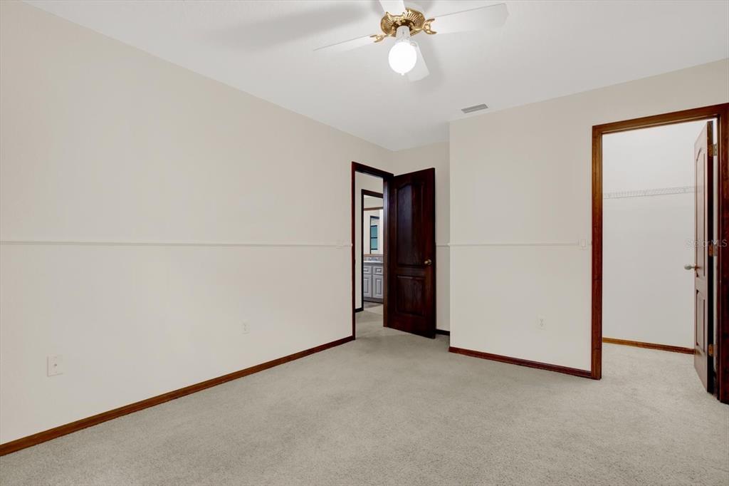 642 Erin Way Brooksville, FL 34601 - Photo 33 of 45 an empty room with a empty space and fan