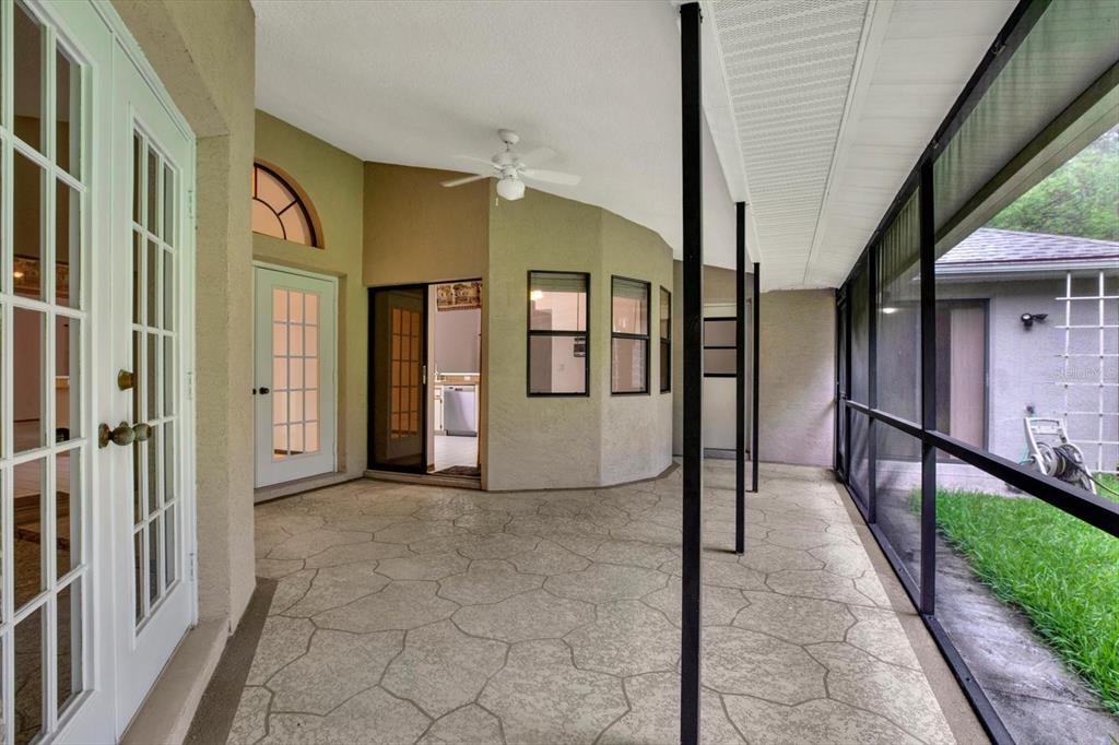 642 Erin Way Brooksville, FL 34601 - Photo 38 of 45 a view of a hallway with wooden walls and stairs