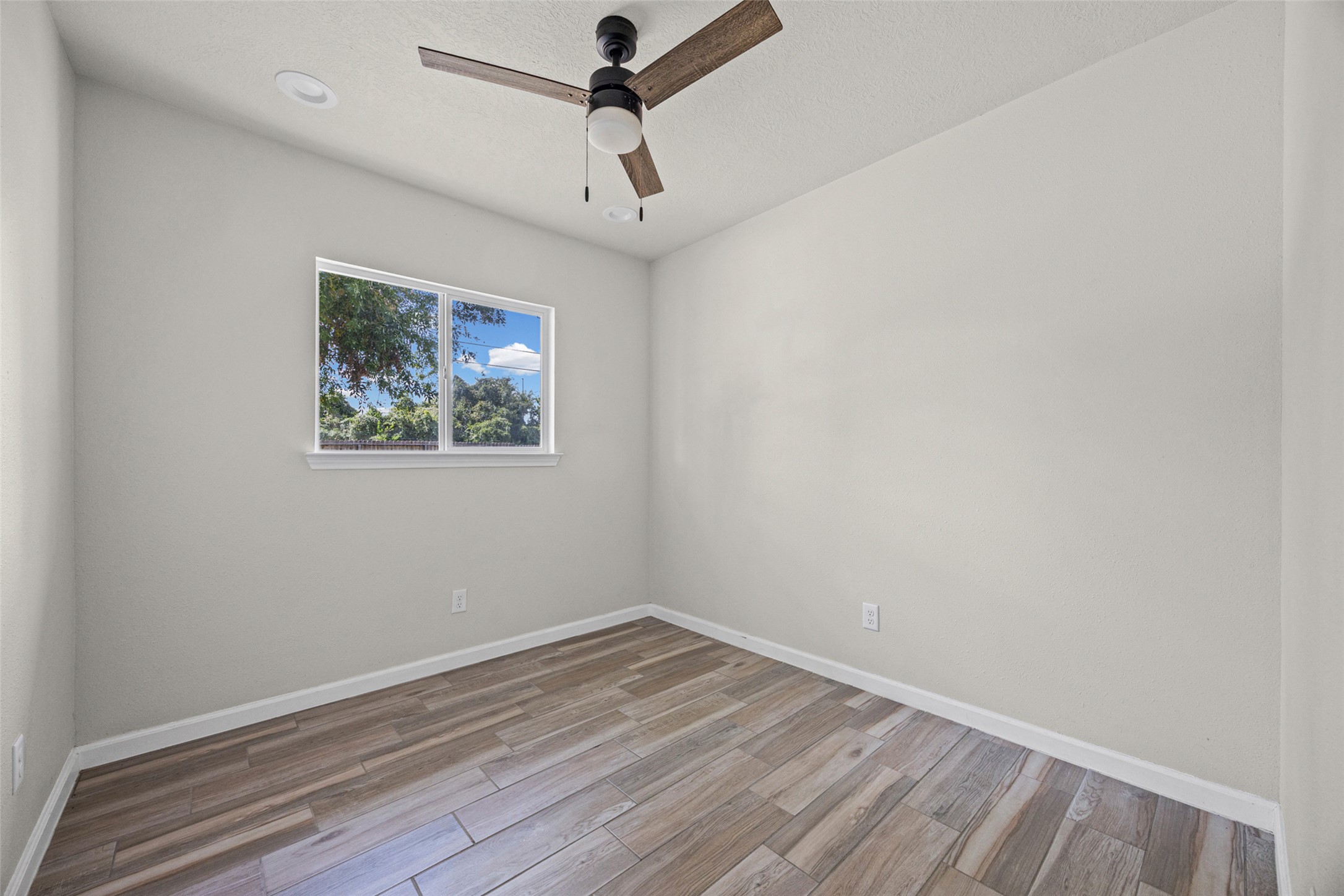 1531 Lahn Road New Braunfels, TX 78130 - Photo 13 of 33 Smooth plaster walls and wood-look tile flooring define this versatile interior space.