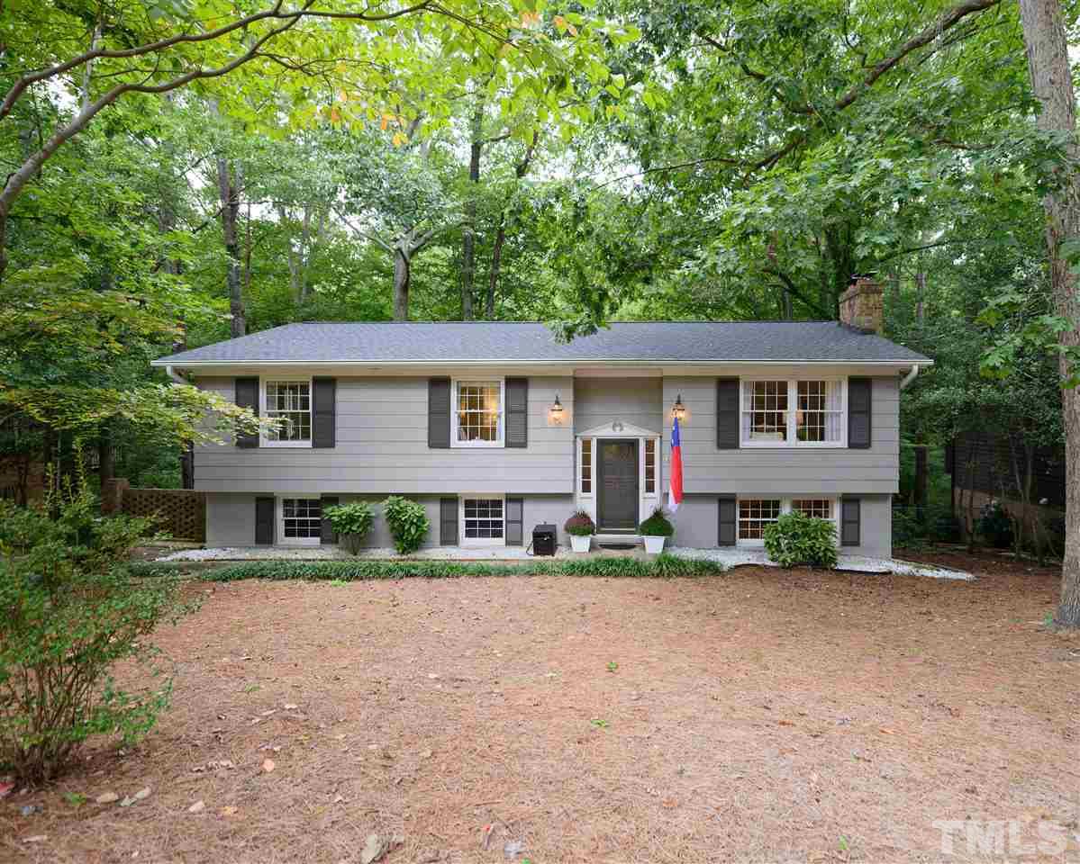 4917 Oak Park Road Raleigh, NC 27612 - Photo 1 of 25 a front view of a residential apartment building with a yard