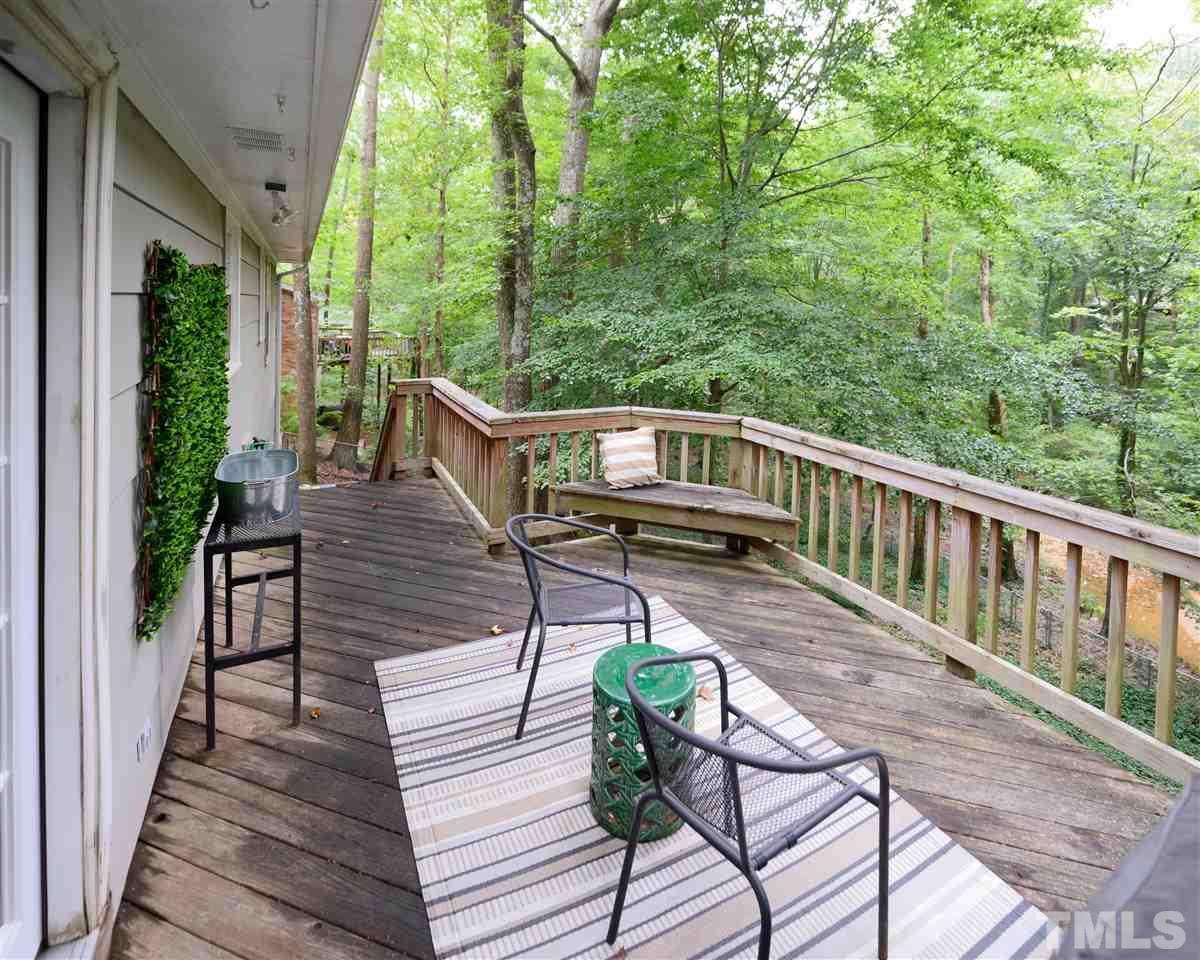 4917 Oak Park Road Raleigh, NC 27612 - Photo 19 of 25 a view of balcony with wooden floor and seating space