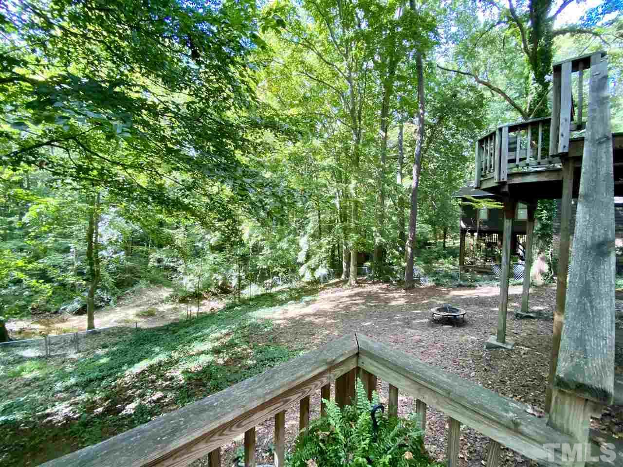 4917 Oak Park Road Raleigh, NC 27612 - Photo 20 of 25 a backyard of a house with lots of green space