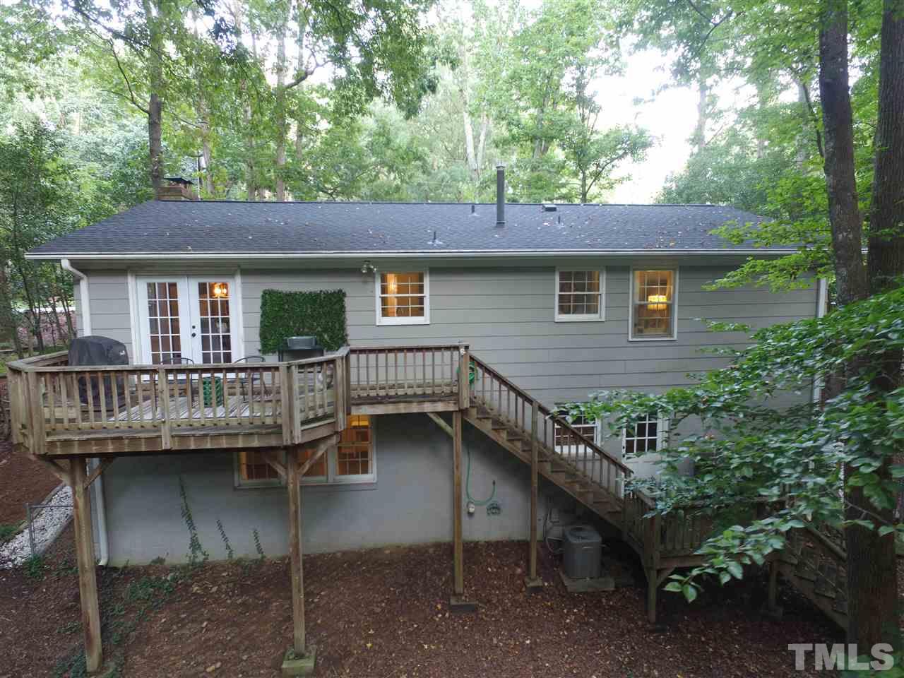 4917 Oak Park Road Raleigh, NC 27612 - Photo 22 of 25 a view of house with a chairs deck