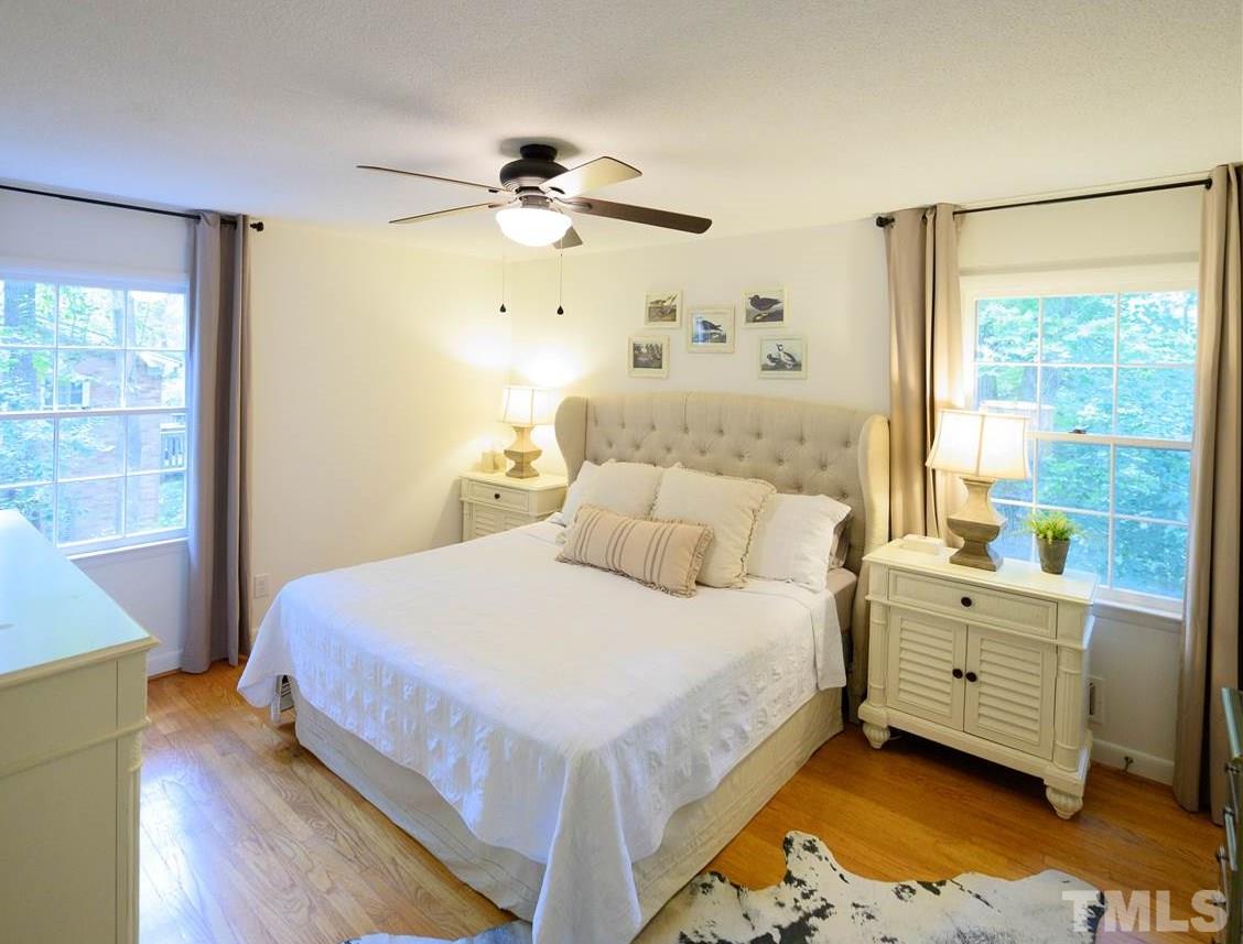 4917 Oak Park Road Raleigh, NC 27612 - Photo 9 of 25 a bedroom with a bed and window