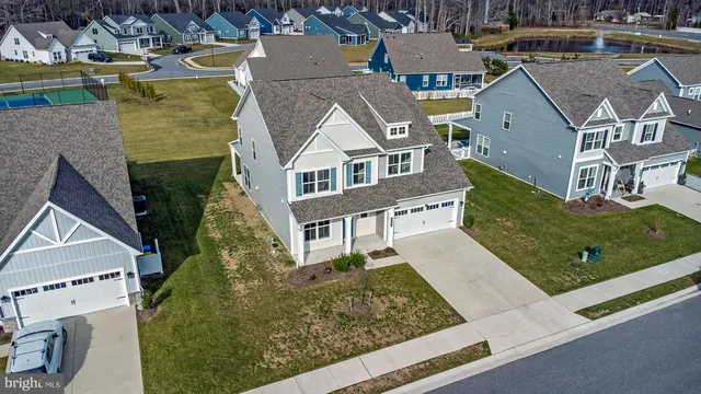 an aerial view of a house with a big yard