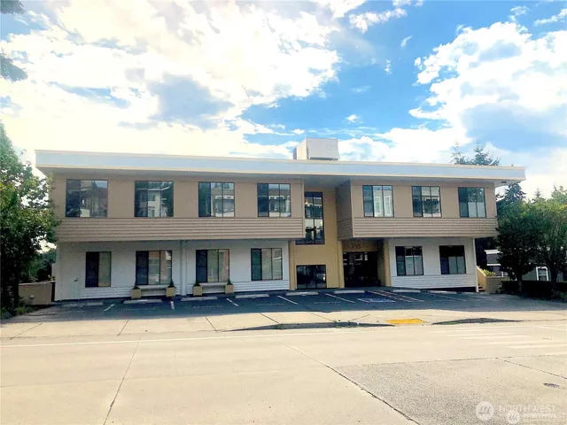 a front view of residential houses with yard