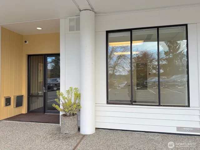 a view of a entryway door front of a house