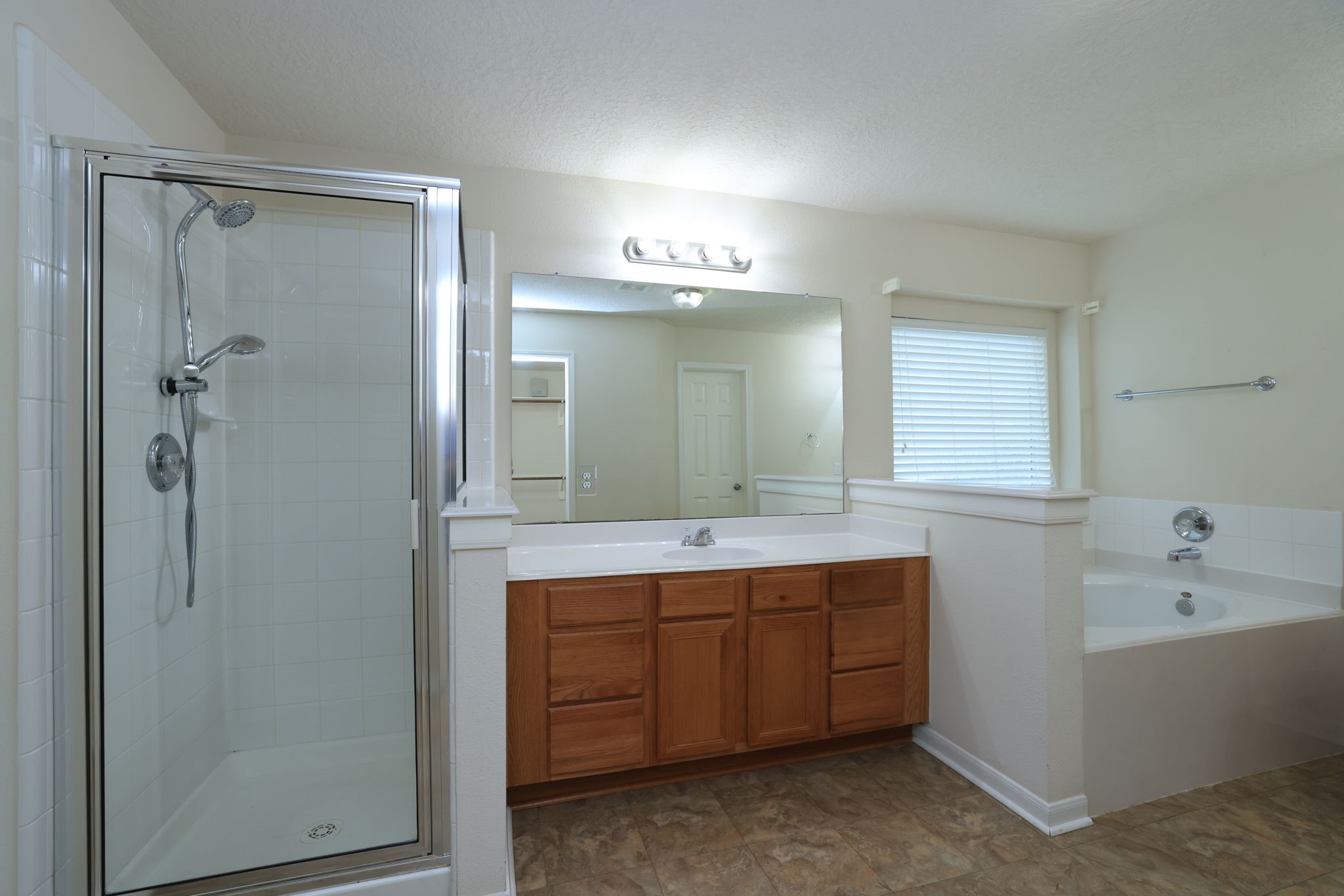 30515 Red Bluff Circle Magnolia, TX 77355 - Photo 19 of 28 Unwind in your luxurious walk-in shower after a busy day.