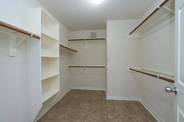 a view of an empty walk in closet