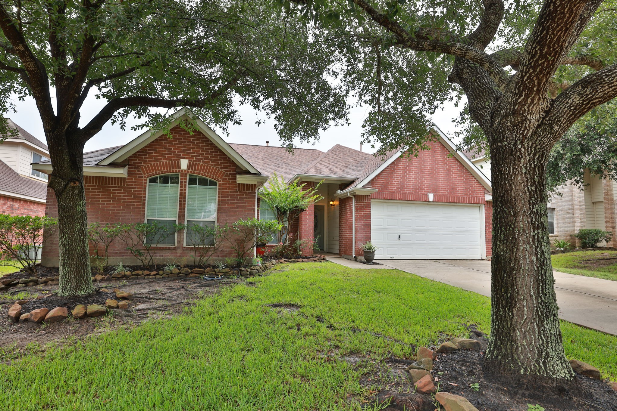 30515 Red Bluff Circle Magnolia, TX 77355 - Photo 2 of 28 This one story home is complete with a two-car garage, nestled among mature trees. Features a well-maintained lawn and landscaped front yard, providing excellent curb appeal. Perfect for family living.