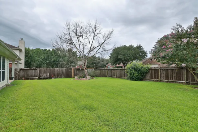 a backyard of a house with lots of green space