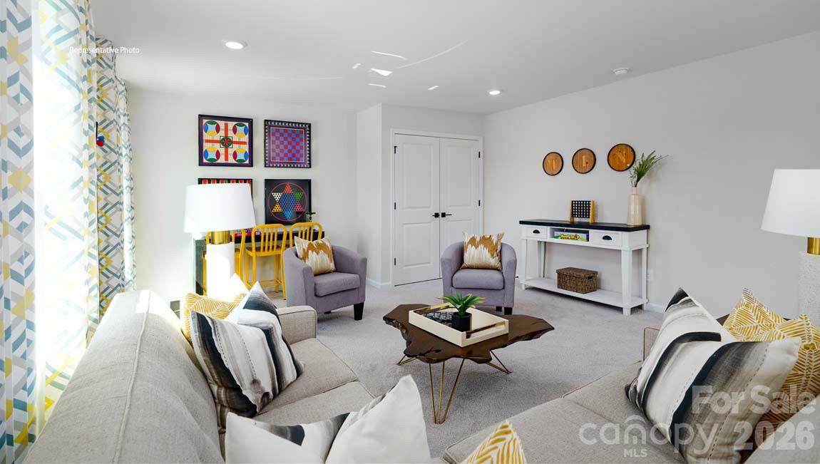 107 Rhuidean Court Troutman, NC 28166 - Photo 15 of 44 a living room with furniture and painting on the wall