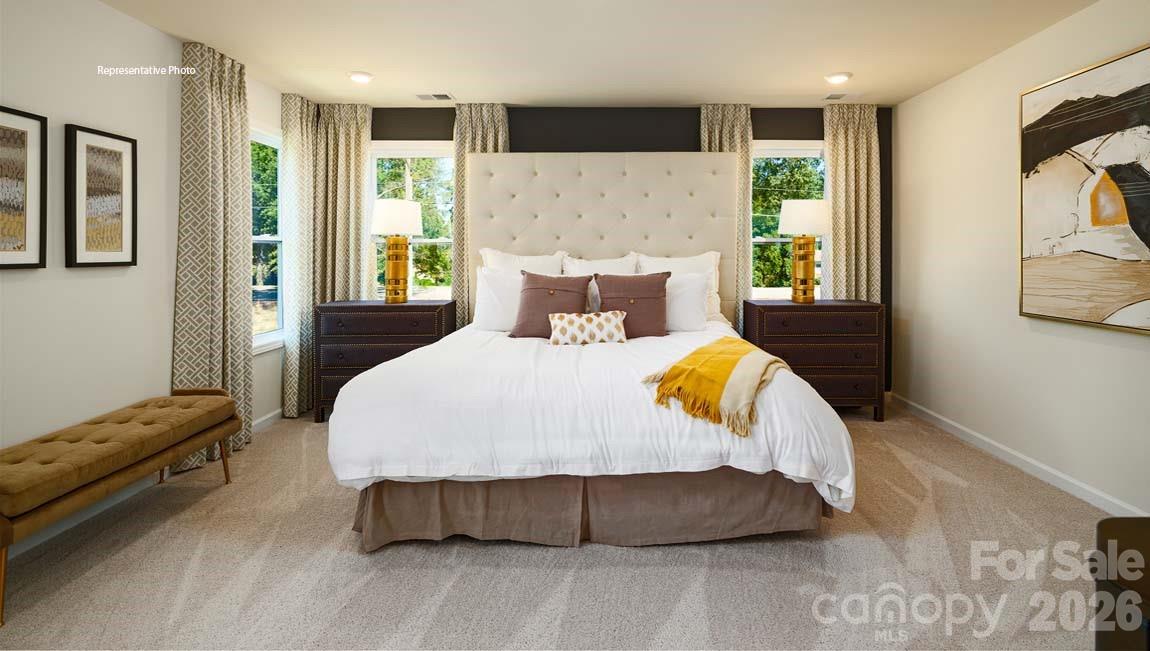 107 Rhuidean Court Troutman, NC 28166 - Photo 20 of 44 a bedroom with a bed window and couch