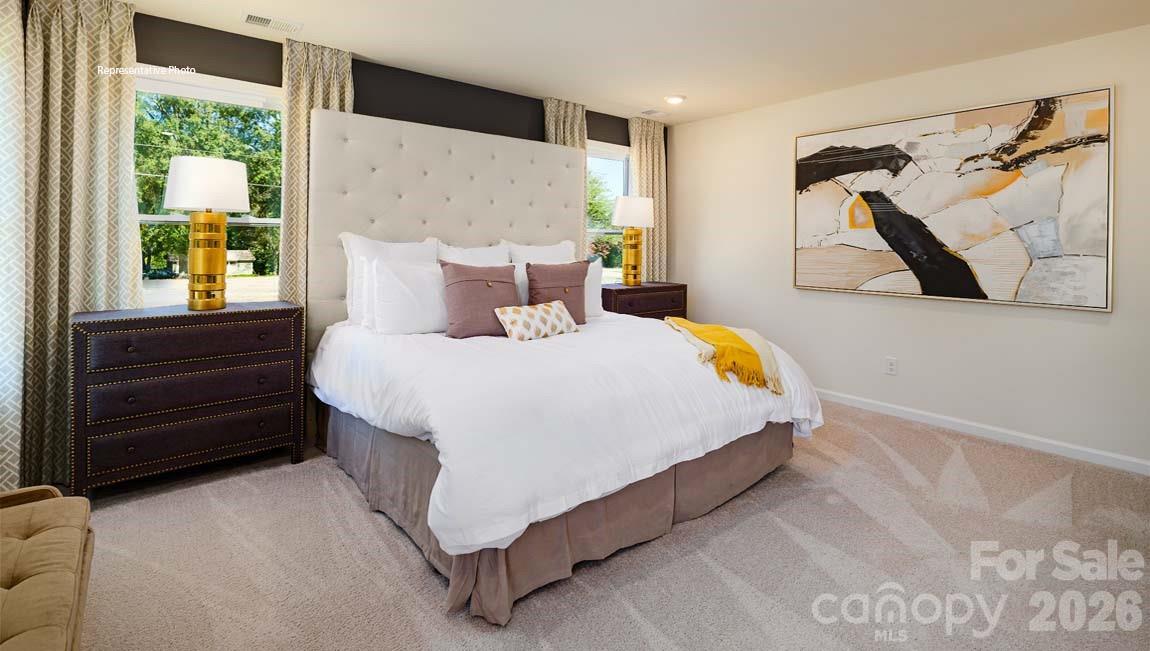 107 Rhuidean Court Troutman, NC 28166 - Photo 21 of 44 a bedroom with a bed and a window