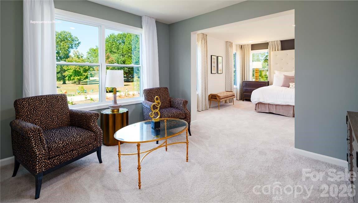 107 Rhuidean Court Troutman, NC 28166 - Photo 25 of 44 a living room with furniture and a large window