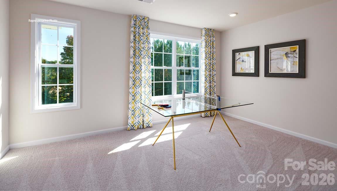 107 Rhuidean Court Troutman, NC 28166 - Photo 43 of 44 a living room with furniture and a window