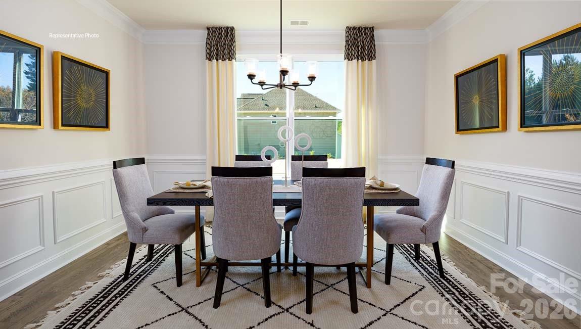 107 Rhuidean Court Troutman, NC 28166 - Photo 9 of 44 a view of a dining room with furniture and window