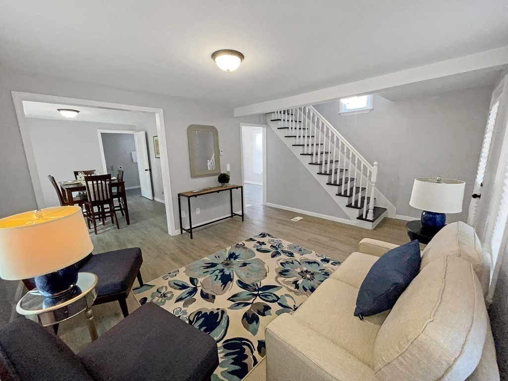12 Ladd Street Springfield, MA 01109 - Photo 11 of 37 a living room with furniture and a chair