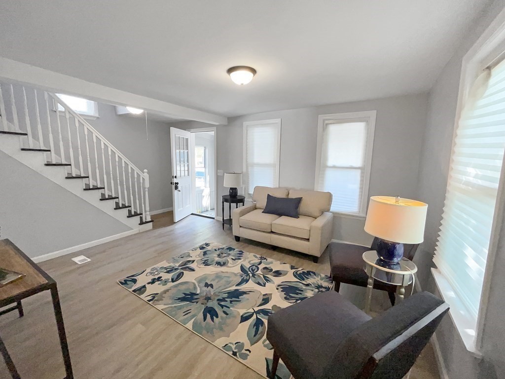 12 Ladd Street Springfield, MA 01109 - Photo 12 of 37 a living room with furniture and a wooden floor