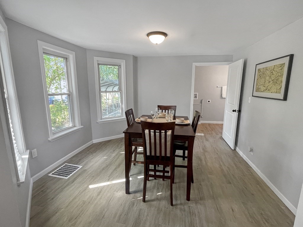 12 Ladd Street Springfield, MA 01109 - Photo 14 of 37 a view of a dining room with furniture and wooden floor