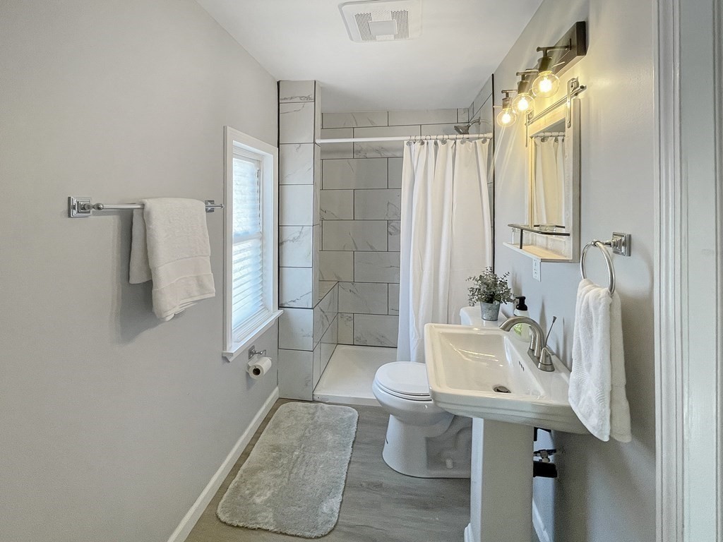12 Ladd Street Springfield, MA 01109 - Photo 17 of 37 a bathroom with a sink toilet and shower