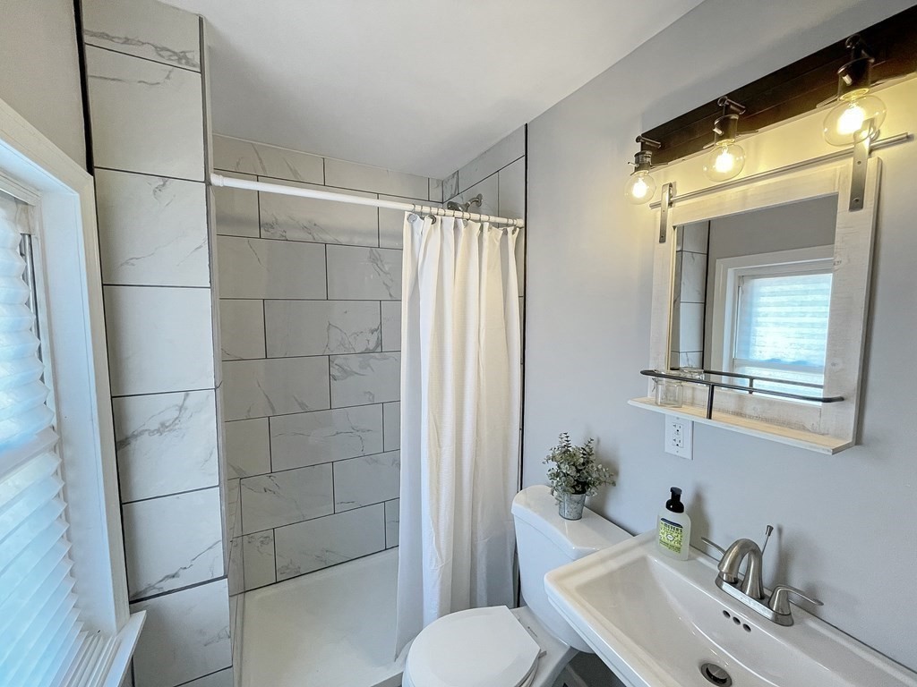 12 Ladd Street Springfield, MA 01109 - Photo 19 of 37 a bathroom with a sink toilet and shower
