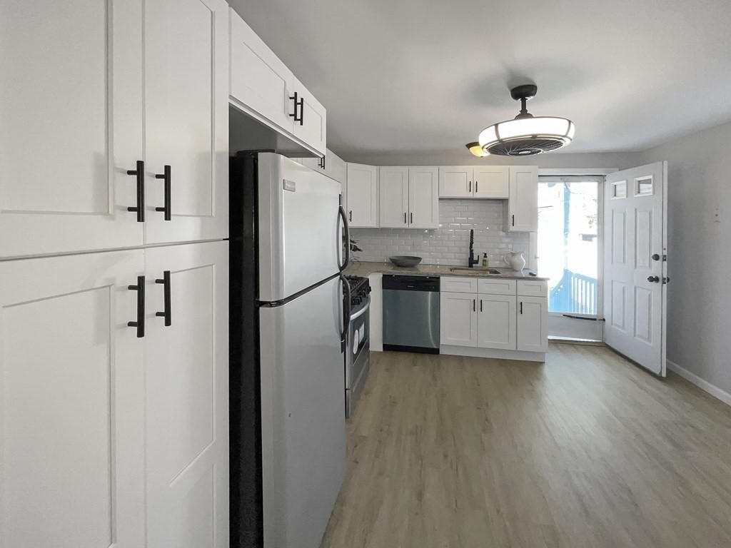 12 Ladd Street Springfield, MA 01109 - Photo 23 of 37 a kitchen with stainless steel appliances a refrigerator sink and cabinets