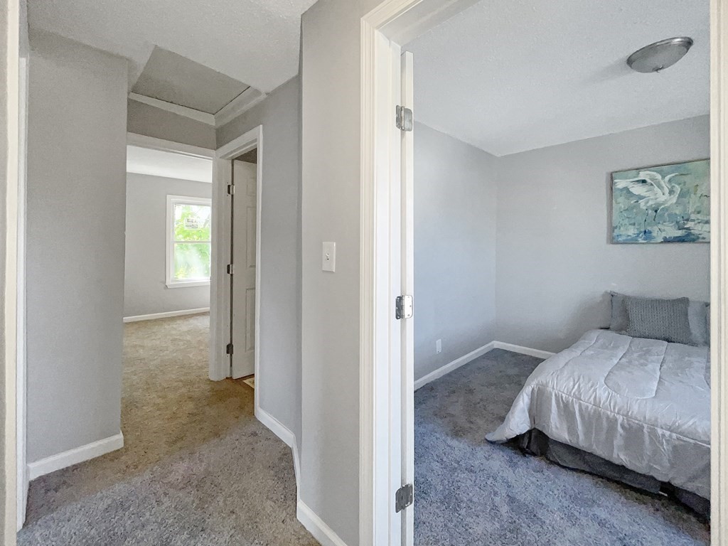 12 Ladd Street Springfield, MA 01109 - Photo 26 of 37 a bedroom with a bed and a painting on the wall