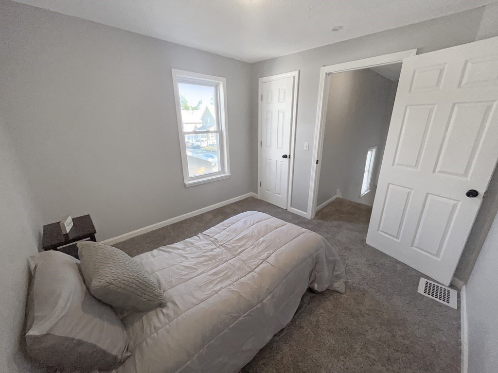 12 Ladd Street Springfield, MA 01109 - Photo 28 of 37 a bedroom with a bed and a window