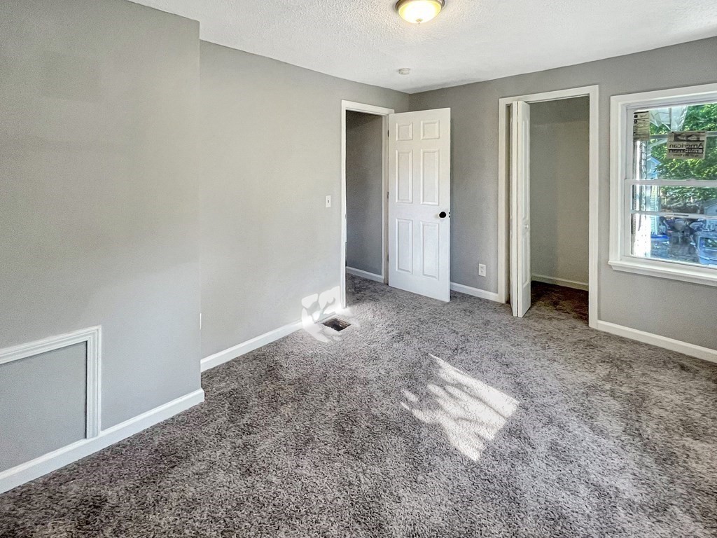 12 Ladd Street Springfield, MA 01109 - Photo 33 of 37 an empty room with windows and closet